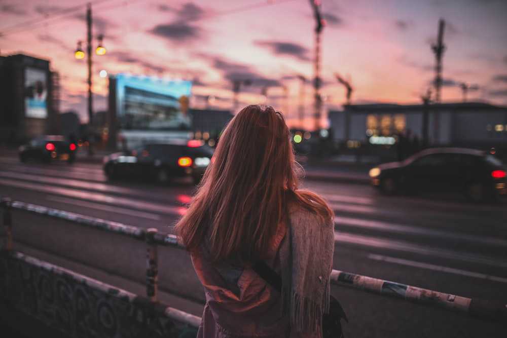 A woman facing a street