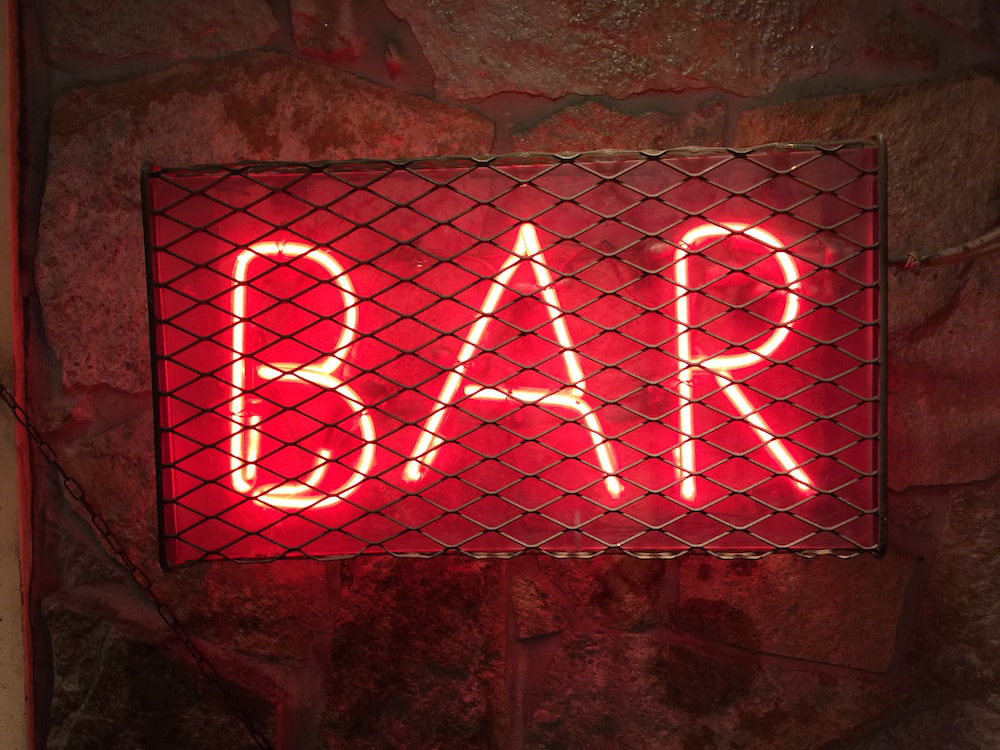 A neon sign saying ‘bar’